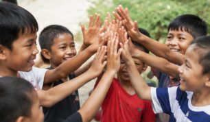 Children joining hands together