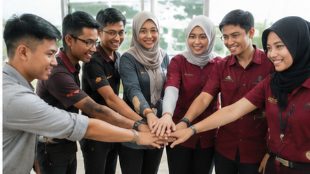 Young volunteers joining hands together